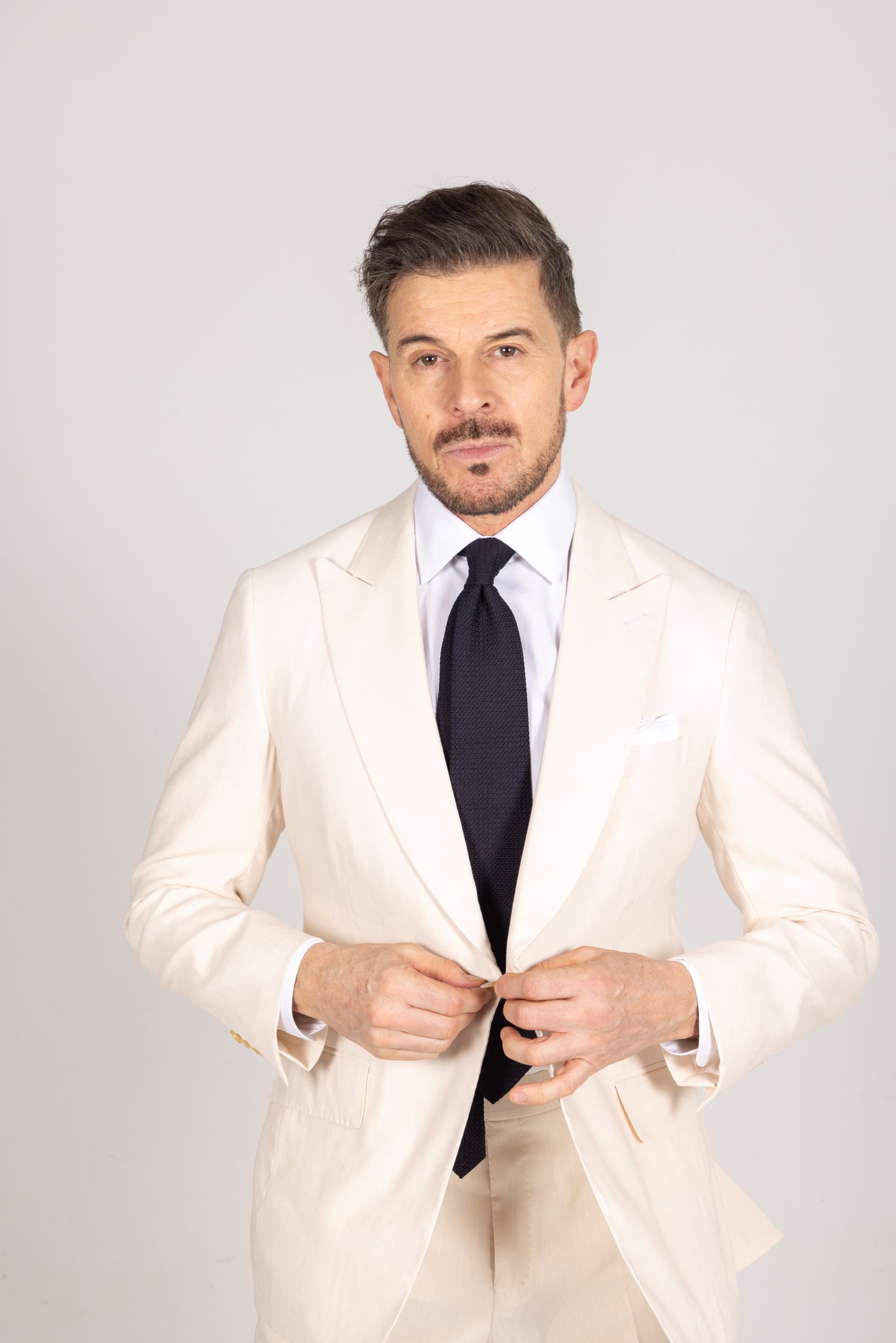
                  
                    Single Breasted Peak Lapel Suit in Cream Wool Linen
                  
                