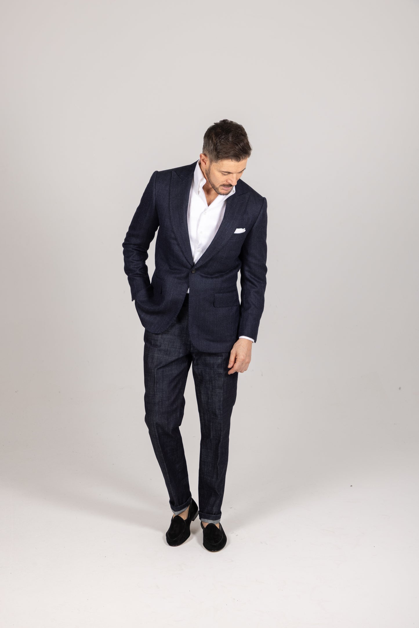 
                  
                    Single Breasted Peak Lapel Jacket in Navy Silk Herringbone
                  
                