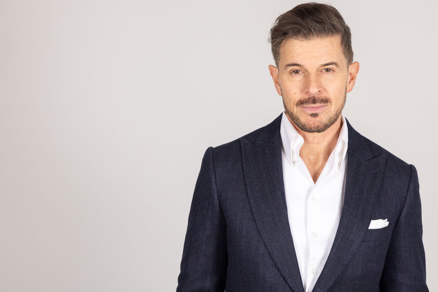 
                  
                    Single Breasted Peak Lapel Jacket in Navy Silk Herringbone
                  
                