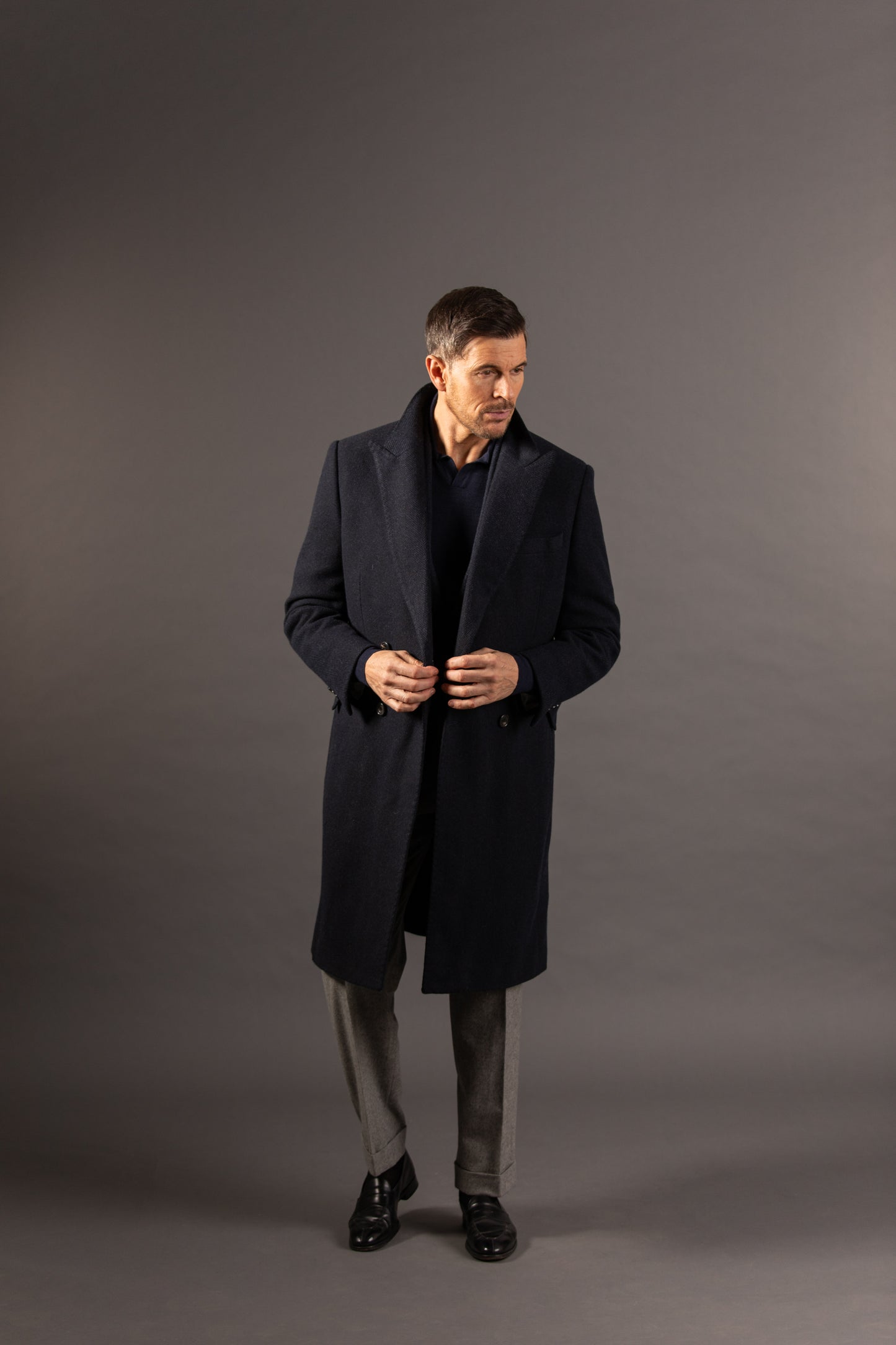 
                  
                    Double Breasted Peak Lapel Overcoat in Navy Herringbone
                  
                