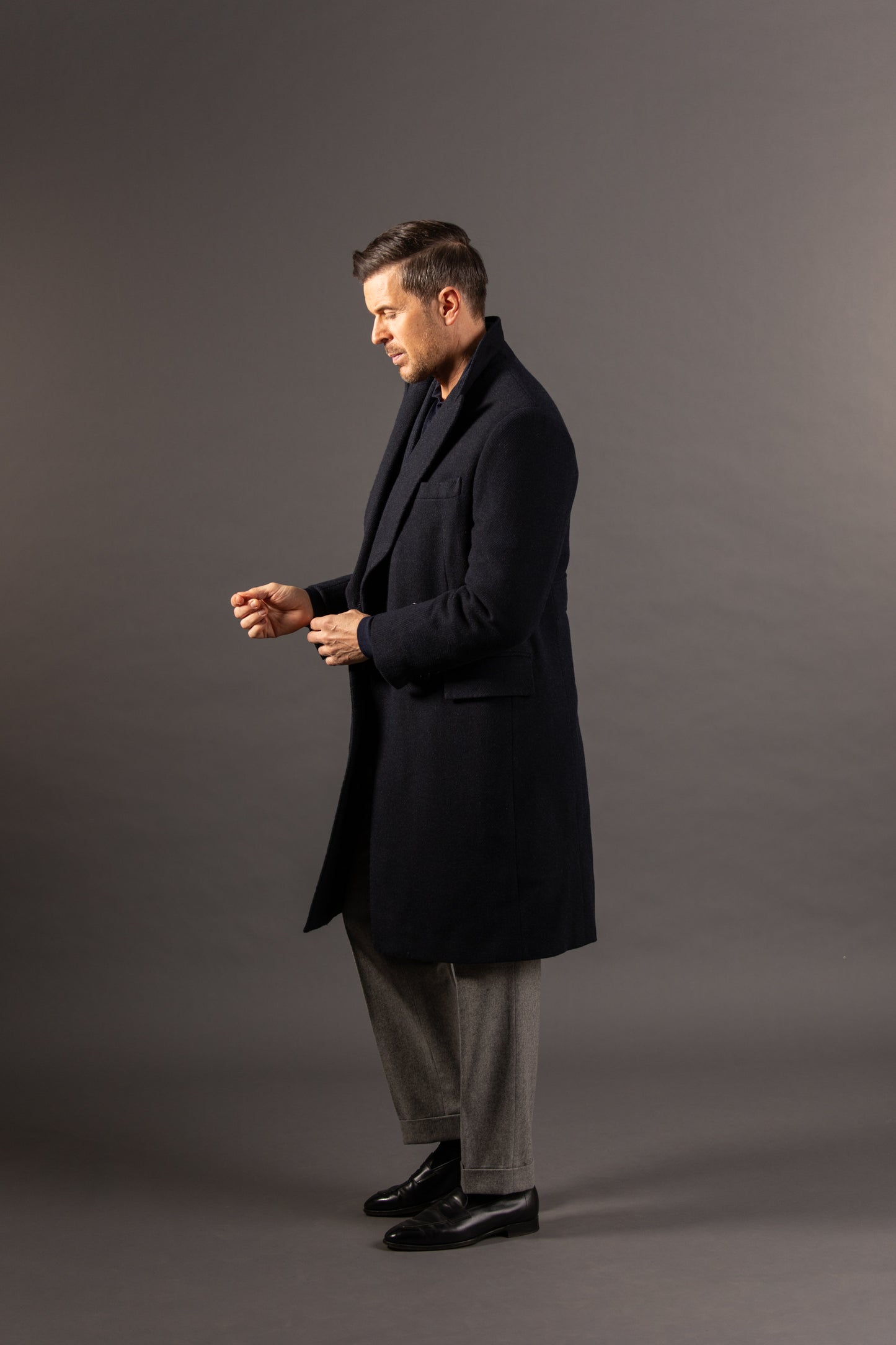 
                  
                    Double Breasted Peak Lapel Overcoat in Navy Herringbone
                  
                